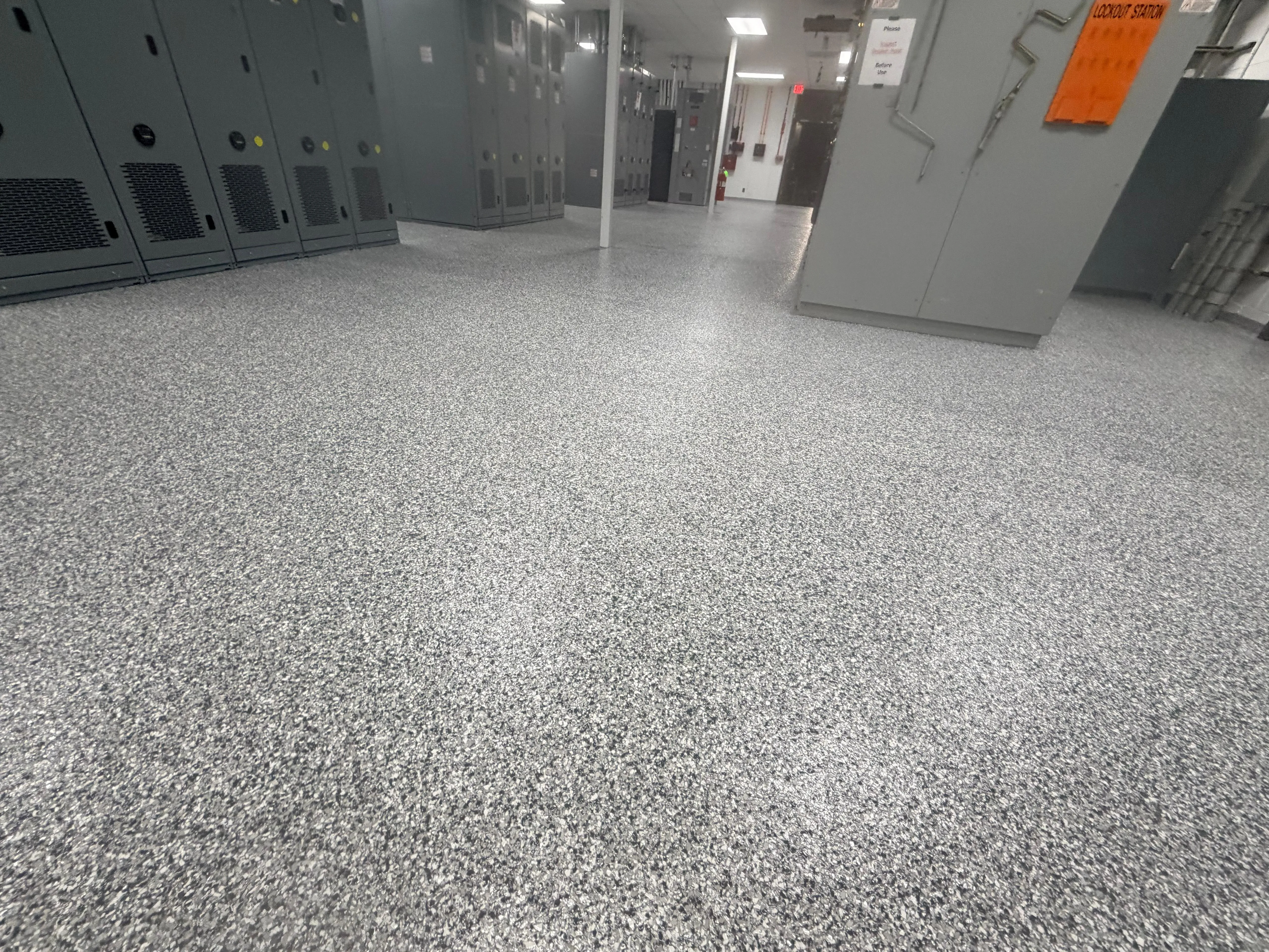 Gray flake epoxy floor through an electrical switchgear room
